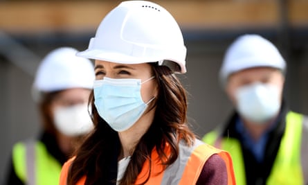 New Zealand Prime Minister Jacinda Ardern wears a mask during a visit to the Kainga Ora housing development in Auckland.