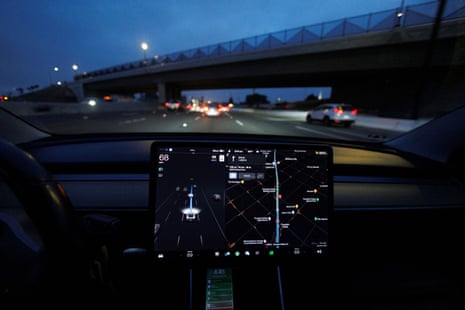 A view of a computer screen mounted on a dashboard, seen in a car at night.