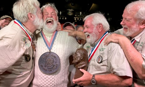 Wally Collins, second from left, is congratulated after beating 130 other men to be crowned the 2014 “Papa”.