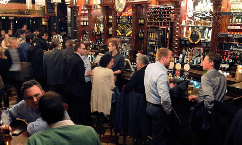 Interior of a busy pub in the City of London