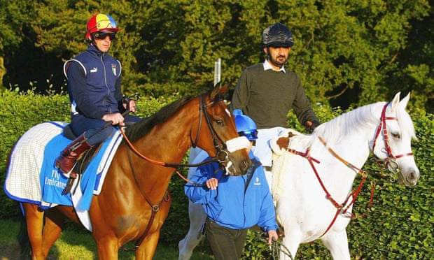 Sheikh Mohammed, right, escorts Frankie Dettori and the Godolphin trained horse Punctilious to the gallops at Newmarket in 2004.