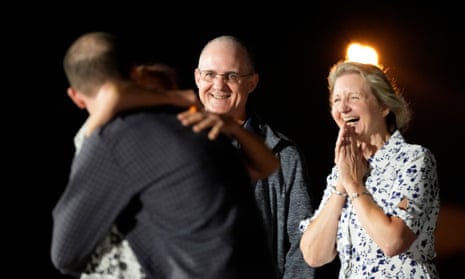 Ella Milman, mother of reporter Evan Gershkovich, from left, hugs her son as fellow released prisoner Paul Whelan and his sister Elizabeth Whelan look on at Andrews Air Force Base.Photograph: Alex Brandon/AP