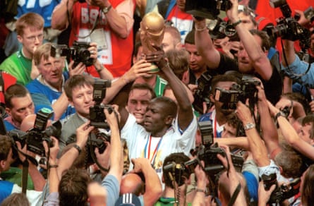 Lilian Thuram holds the World Cup trophy aloft in 1998. In his post-playing career, he has written a number of books on race and discrimination.