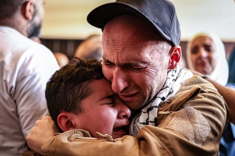 One of the Palestinian prisoners, who was released in the exchange, embraces a loved one after arrivng in Ramallah.