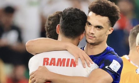 The embrace that went viral: Antonee Robinson comforts Iran’s Ramin Rezaeian after the World Cup group encounter in Qatar. ‘In that moment you don’t even notice cameras. You’re just seeing another guy in a lot of pain.’