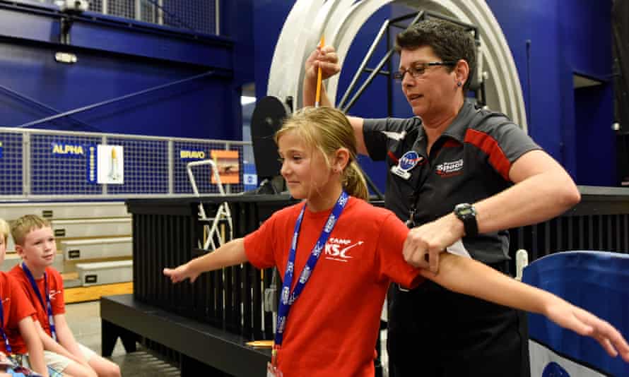 Camper Danica Linforth, 8, gets ready to spin under a pencil held by educator Dee Maynard during Camp KSC at the U.S. Astronaut Hall of Fame, Kennedy Space Center Visitor Complex on July 23, 2015. Photo by Todd Anderson Instagram - TODD389 Twitter - @ta1dxjd