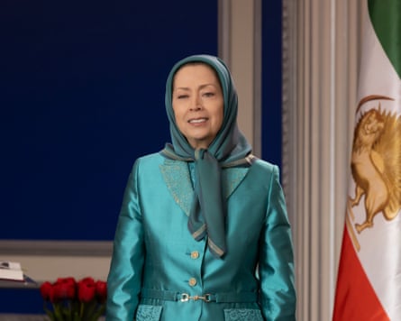 Maryam Rajavi stands beside the Iranian flag during a Nowruz ceremony in which she addressed supporters and members of the Iranian resistance