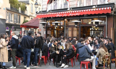 Customers sit on outside terraces in Paris as cafes, restaurants, and other businesses re-open.