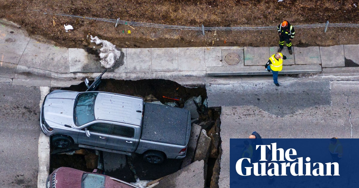 Sinkhole swallows two vehicles on Omaha street corner
