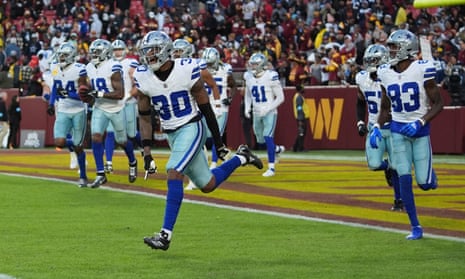 Dallas Cowboys safety Juanyeh Thomas celebrates after scoring a 43-yard touchdown off a kickoff return against the Washington Commanders