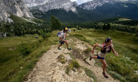 Two people running in the Italian Dolomites