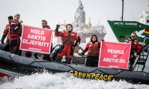 Greenpeace activists hold banners during a protest next to Statoil’s Songa Enabler oil rig in the Barents sea, Norway, July 2017