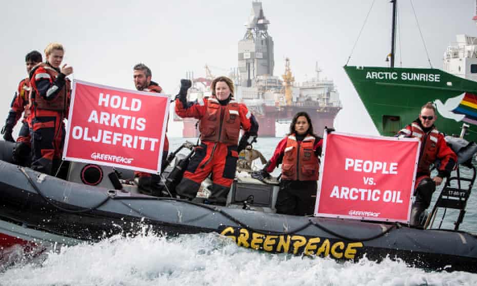 Greenpeace activists hold banners during a protest next to Statoil’s Songa Enabler oil rig in the Barents sea, Norway, July 2017