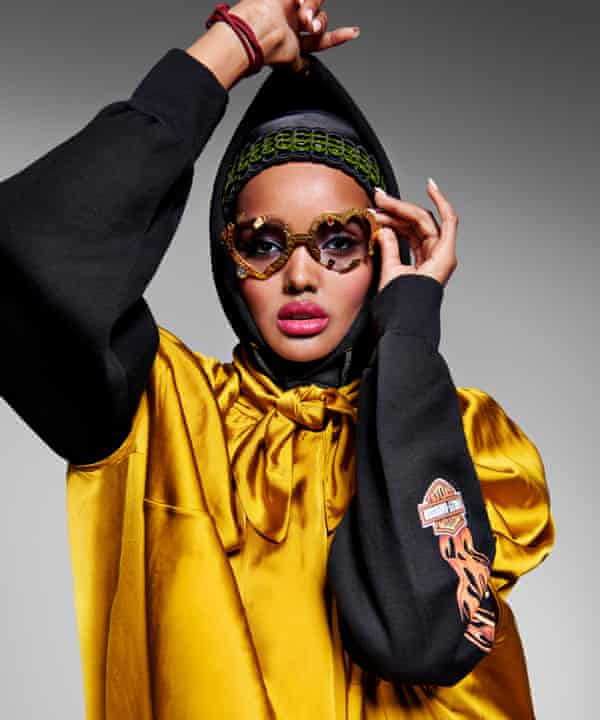 My story isn’t just: ‘I grew up in a refugee camp’: Halima Aden wears hoodie by rokit.co.uk; dress by Ssōne, matchesfashion.com; glasses by francisdelara.com; and bag strap, worn as a headband, bottletop.com.