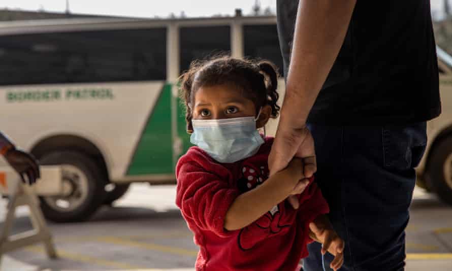 A young asylum seeker arrives with her family at a bus station after being released by US border patrol in Brownsville, Texas, on 25 February.