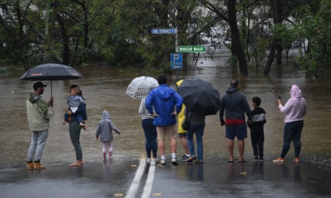 Thousands of residents are fleeing their homes, schools are shut, and scores of people have been rescued as NSW is hit by once-in-a-generation flooding.
