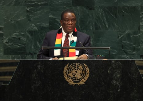 Zimbabwe's president Emmerson Mnangagwa speaking on stage with his signature colourful scarf.