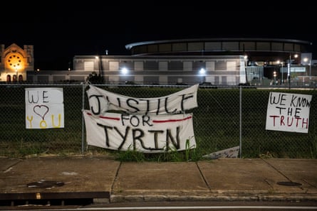 A sign hanging on a gate says âÂÂJustice for TyrinâÂÂ