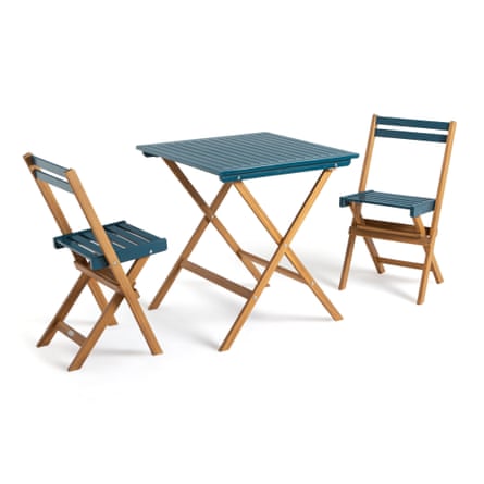 Two folding wooden chairs and matching table. The table top is blue and square with wooden legs. Each chair has a wooden frame with the seat and back rests are blue.
