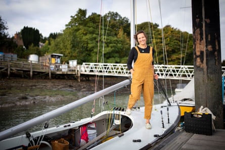 A woman standing on a white racing boat