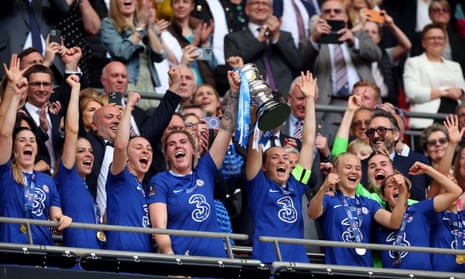 Millie Bright and Magdalena Eriksson lift the Women's FA Cup after victory over Manchester United.