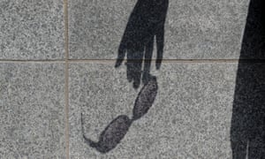 Shadow of 'Rachel' holding sunglasses