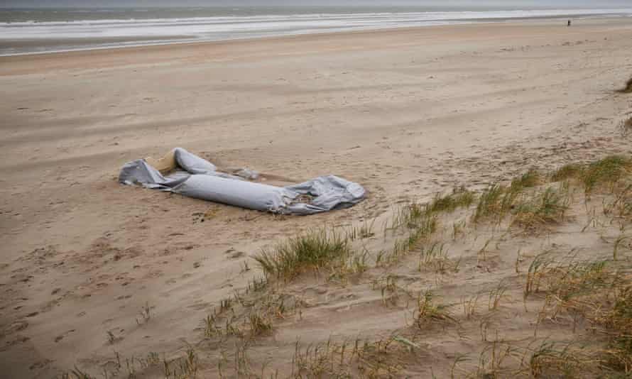 An abandoned dinghy on the beach at Dunkirk.