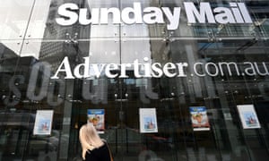 exterior of News Corp building with advertiser and sunday mail signs