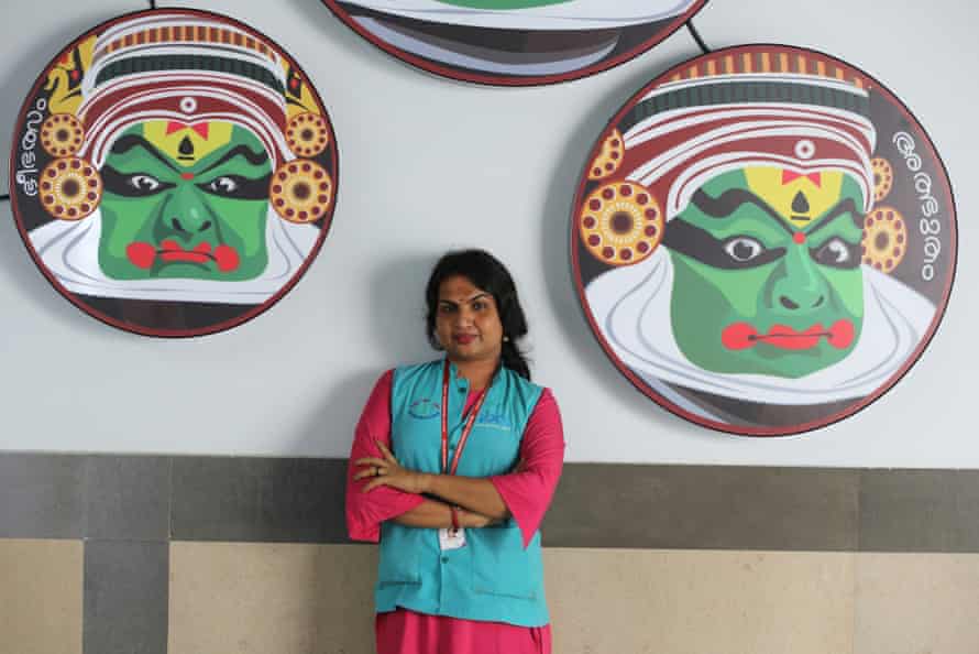 Transgender Kothi Metro employee Karthika, 33, poses at Changampuzha Park metro station