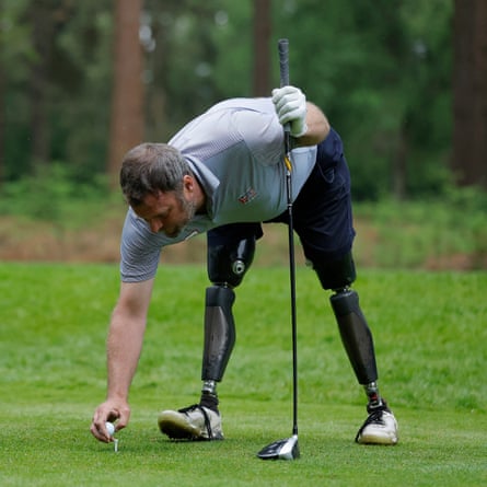 Ian Bishop, a double amputee golfer originally from England who now lives in southern Spain, is a former soldier who in 2009 had both legs blown off when stepping on a device in Helmand Province, Afghanistan. Here he tees it up on the first hole