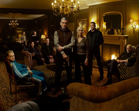 Family sitting and standing in dimly lit living room