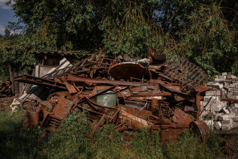 Remnants of a house, destroyed by shelling, lie in a yard