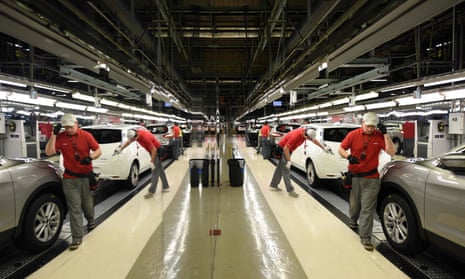 In this file photo taken in 2014 members of Nissan’s manufacturing staff work in the ‘Trim and Chassis’ section of their Sunderland Plant.