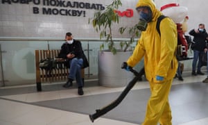 A federal employee disinfecting Leningradsky railway station in Moscow on Tuesday.