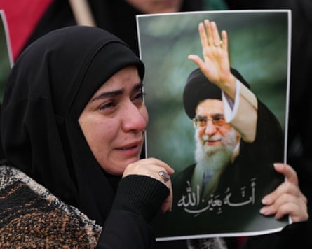 A woman mourns the death of Ayatollah Ali Khamenei at a gathering in Beirut