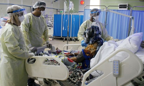 Medical staff attend to a coronavirus patient at a quarantine centre run by Médecins Sans Frontières in Aden, Yemen