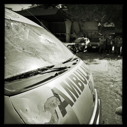Al-Amal hospital’s car park, full of destroyed ambulances and civilian vehicles