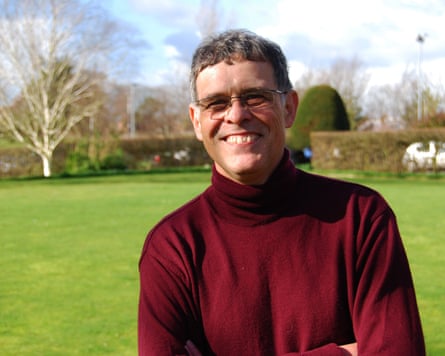 Prof Keith Walters in a maroon red pull-neck jumper
