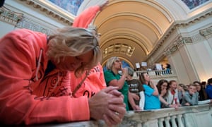 Oklahoma teachers observe a moment of silence during a rally at the state capitol.