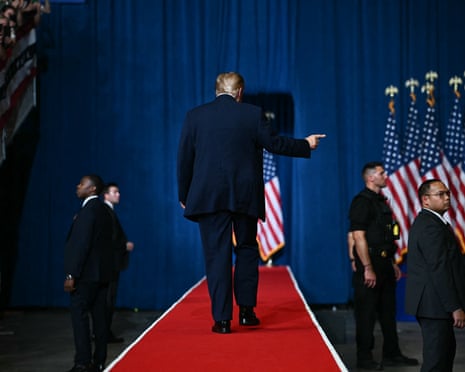 Donald Trump he walks off stage during a campaign rally at the Heartland Credit Union Arena in Park City, Kansas