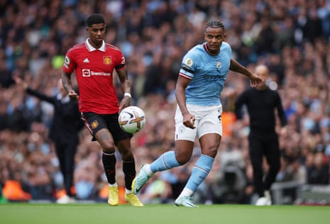Manchester City v Manchester United: Premier League — live | Premier League 5 Manuel Akanji shepherds the ball away from Marcus Rashford.