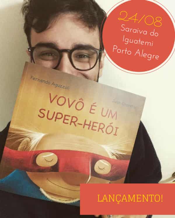 A young man holds up a book with a cartoon of an old woman as a super-hero