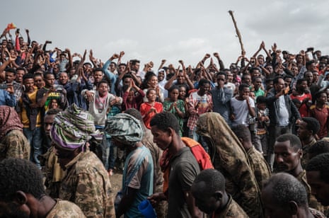People react as captive Ethiopian soldiers walk towards Mekelle rehabilitation centre in Mekelle, the capital of Tigray region, Ethiopia, on 2 July