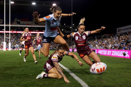 NSW’s Jessica Sergis jumps over Queensland’s Julia Robinson in the first half.