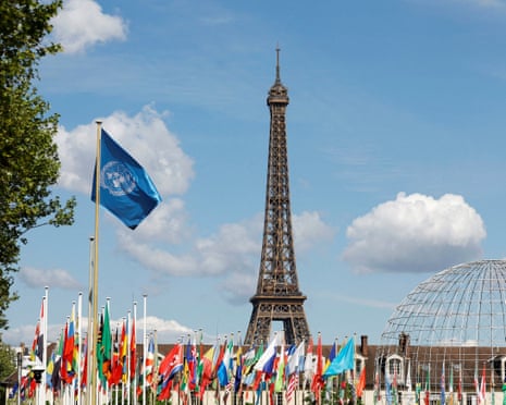 The Unesco flag flying in front of the Eiffel Tower.