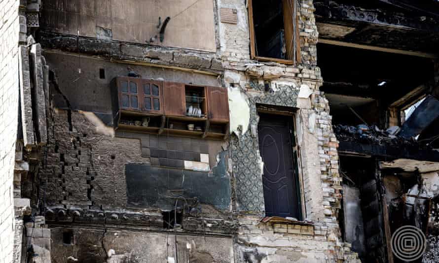 The cockerel on top of a kitchen cabinet, in a home destroyed by Russian shelling in Borodyanka