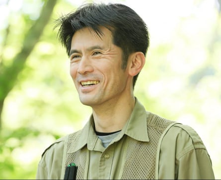 A smiling man in khaki