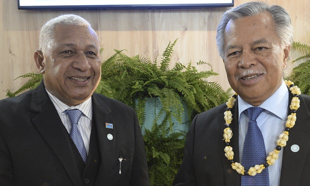 Fijian PM Frank Bainimarama and Cooks Islands counterpart Henry Puna at Katowice.