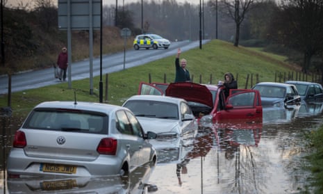 Cars submerged by heavy rainfall