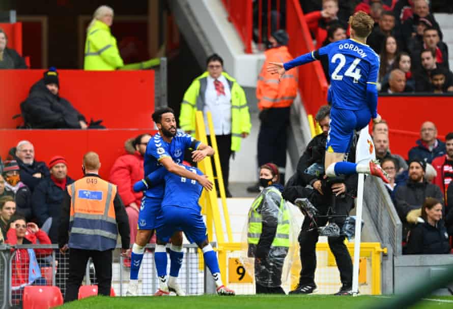 Andros Townsend celebrates with teammates Demarai Gray and Anthony Gordon after scoring Everton’s equaliser against Manchester United at Old Trafford